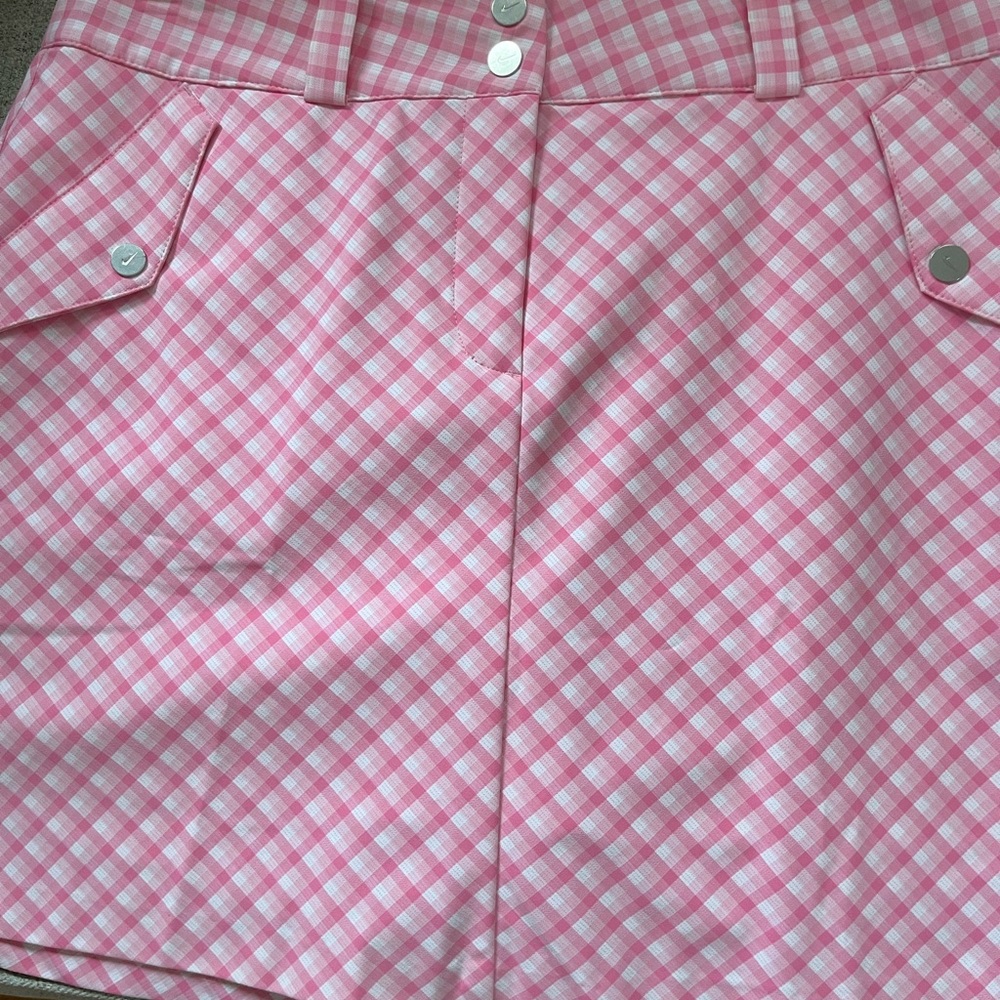 NIKE golf skort, like new, Dri-fit, 8 medium. NIKE logo on the buttons